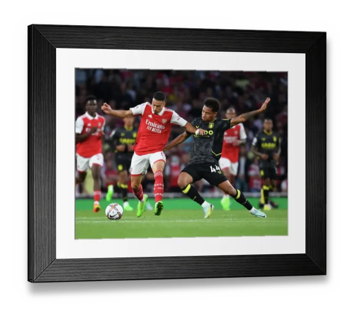 Framed Print : Arsenal vs Aston Villa: Martinelli Takes on Kanas in Premier League Clash (2022-23)