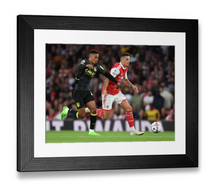 Framed Print : Arsenal's Xhaka Clashes with Villa's Konsa in 2022-23 Premier League Showdown Framed Print : Arsenal's Xhaka Clashes with Villa's Konsa in 2022-23 Premier League Showdown
