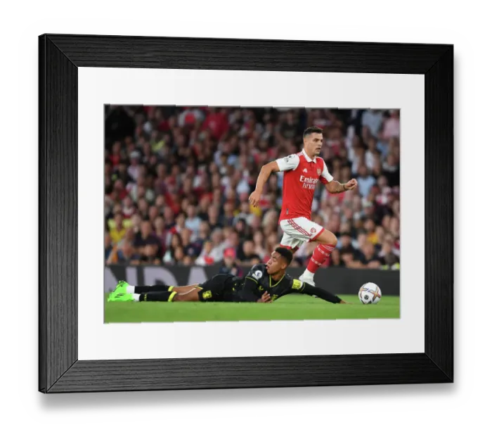 Framed Print : Arsenal's Xhaka Clashes with Aston Villa's Konsa in 2022-23 Premier League Showdown Framed Print : Arsenal's Xhaka Clashes with Aston Villa's Konsa in 2022-23 Premier League Showdown