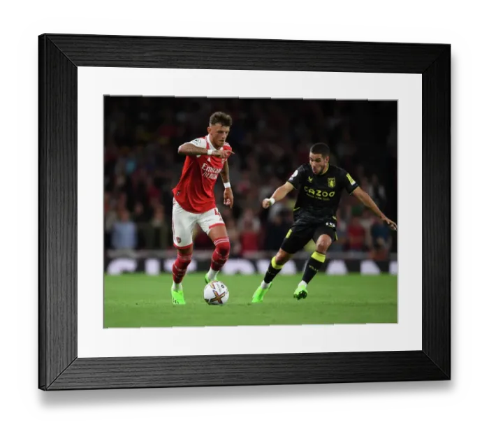 Framed Print : Arsenal's Ben White Outmaneuvers Aston Villa's Emiliano Buendia in Premier League Clash at Emirates Stadium