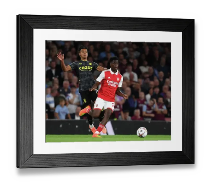 Framed Print : Arsenal's Sambi Outmaneuvers Aston Villa's Ollie Watkins in 2022-23 Premier League Clash