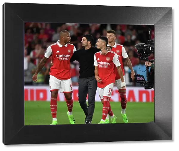 Arsenal's Winning Team: Arteta Celebrates with Gabriel, Martinelli, and White