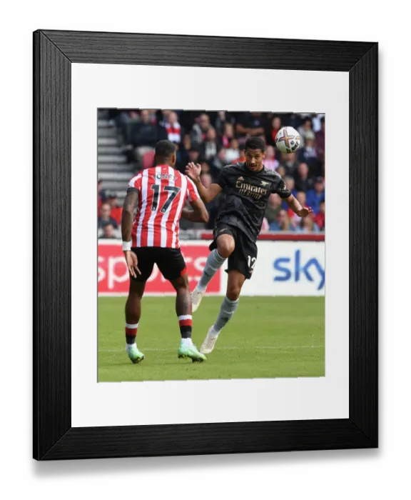 Framed Print : Saliba Heads Away: Brentford vs Arsenal, Premier League 2022-23 Framed Print : Saliba Heads Away: Brentford vs Arsenal, Premier League 2022-23