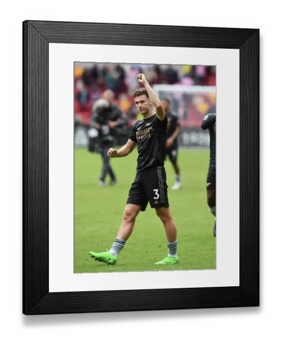 Framed Print : Arsenal's Kieran Tierney Celebrates Victory Over Brentford in 2022-23 Premier League Framed Print : Arsenal's Kieran Tierney Celebrates Victory Over Brentford in 2022-23 Premier League