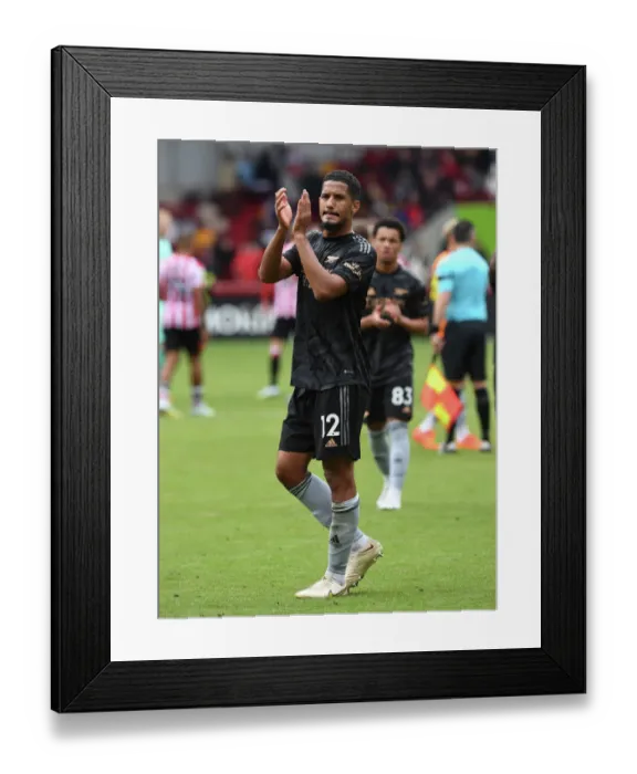 Framed Print : Arsenal's William Saliba Applauding Fans After Brentford Victory - Premier League 2022-23