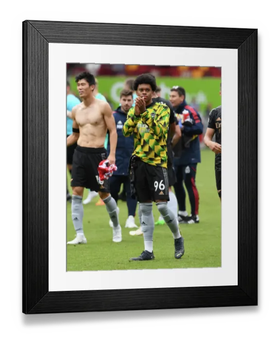 Framed Print : Arsenal's Lino Sousa Celebrates with Fans after Brentford Victory - Premier League 2022-23 Framed Print : Arsenal's Lino Sousa Celebrates with Fans after Brentford Victory - Premier League 2022-23