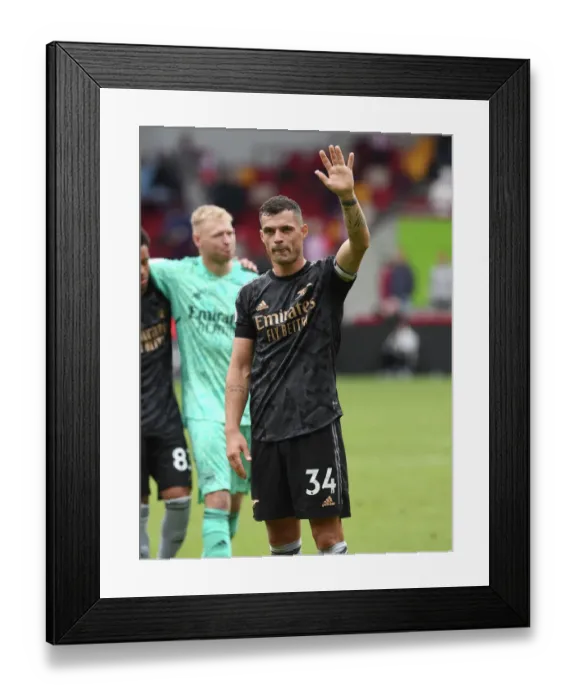Framed Print : Granit Xhaka Celebrates Arsenal's Win at Brentford Community Stadium