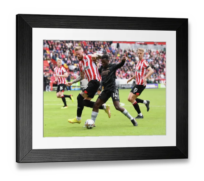 Framed Print : Brentford vs. Arsenal: Intense Clash Between Nketiah and Jansson in the 2022-23 Premier League