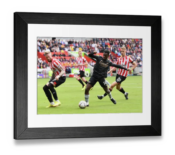 Framed Print : Brentford vs Arsenal: Nketiah Faces Off Against Jansson in Premier League Clash