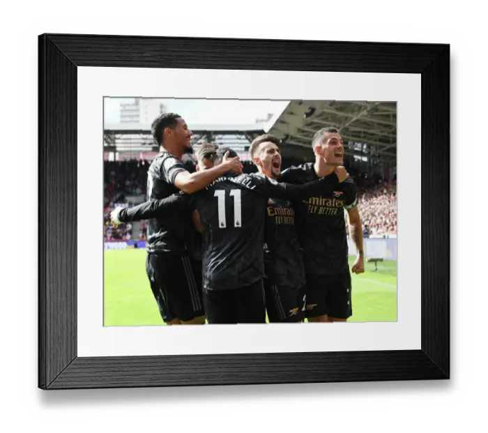 Framed Print : Arsenal's Triumph: Vieira, Xhaka, Martinelli, and Saliba Celebrate 3rd Goal vs. Brentford (2022-23)