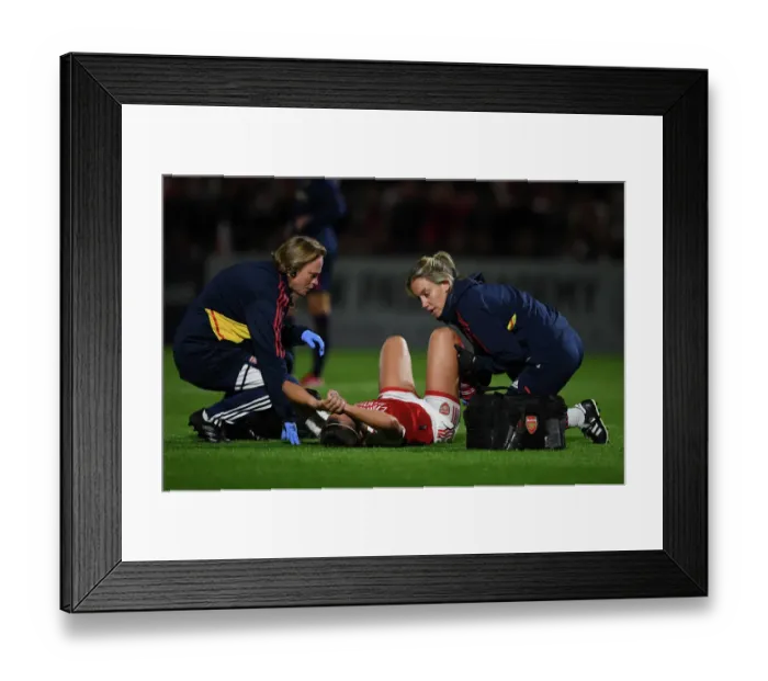 Framed Print : Arsenal Women vs AFC Ajax: Caitlin Foord Receives Medical Attention in UEFA Women's Champions League Clash
