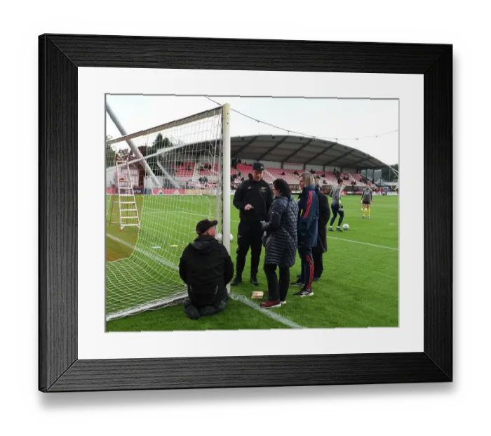 Framed Print : Arsenal's Jonas Eidevall Checks Goal Height Before Ajax Clash in UEFA Women's Champions League