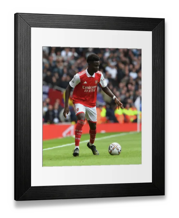 Framed Print : Arsenal's Bukayo Saka Faces Off Against Tottenham in the Intense 2022-23 Premier League Showdown