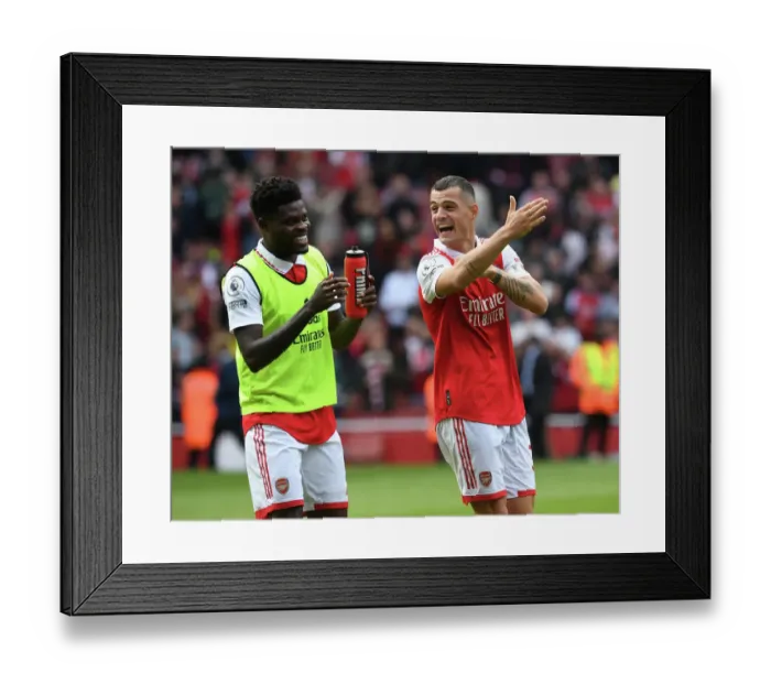 Framed Print : Arsenal's Partey and Xhaka Share a Moment After Arsenal v Tottenham Premier League Clash (2022-23) Framed Print : Arsenal's Partey and Xhaka Share a Moment After Arsenal v Tottenham Premier League Clash (2022-23)