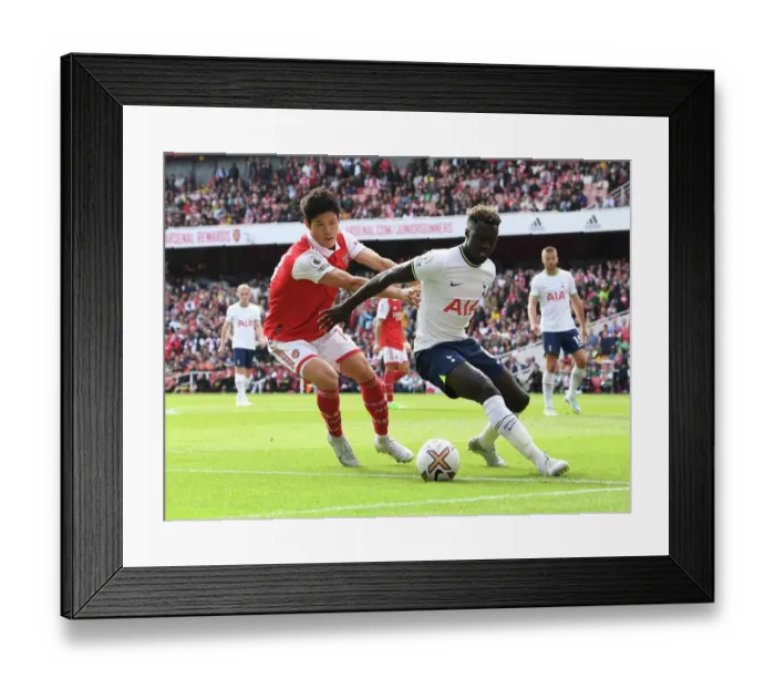 Framed Print : Arsenal vs. Tottenham: Tomiyasu Shuts Down Sanchez in Intense Premier League Clash (2022-23)