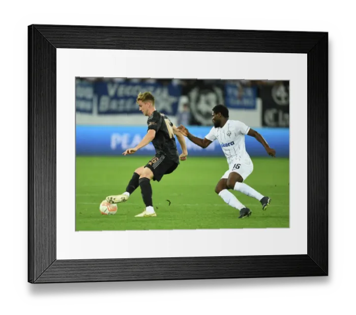 Framed Print : Arsenal's Rob Holding Clashes with Zurich's Tosin in Europa League Group A Match Framed Print : Arsenal's Rob Holding Clashes with Zurich's Tosin in Europa League Group A Match