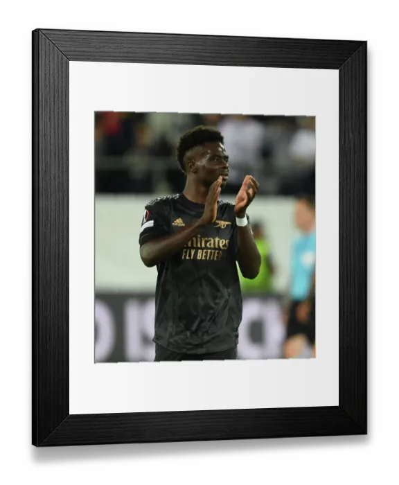 Framed Print : Arsenal's Bukayo Saka Celebrates with Fans after UEFA Europa League Win over FC Zurich Framed Print : Arsenal's Bukayo Saka Celebrates with Fans after UEFA Europa League Win over FC Zurich