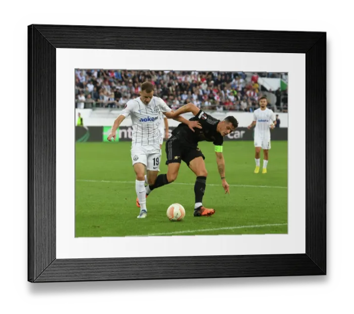 Framed Print : Granit Xhaka Clashes with Nikola Boranijasevic: FC Zurich vs. Arsenal, UEFA Europa League 2022-23