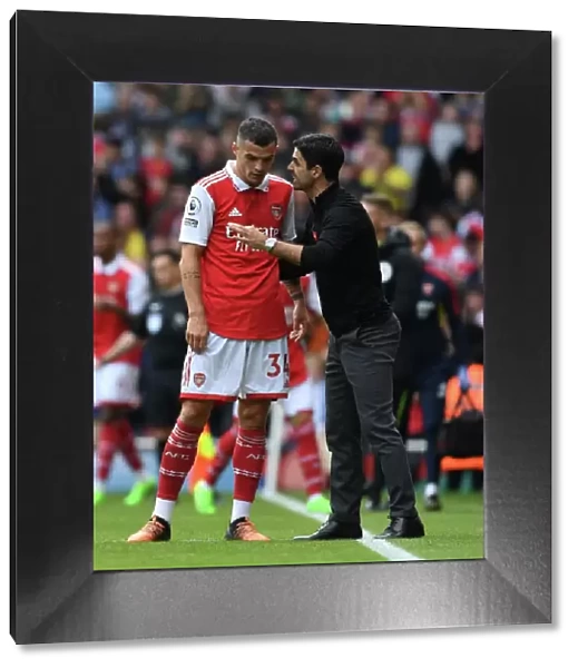 Arsenal Manager Mikel Arteta Conferencing with Granit Xhaka during Arsenal vs. Tottenham, 2022-23 Premier League