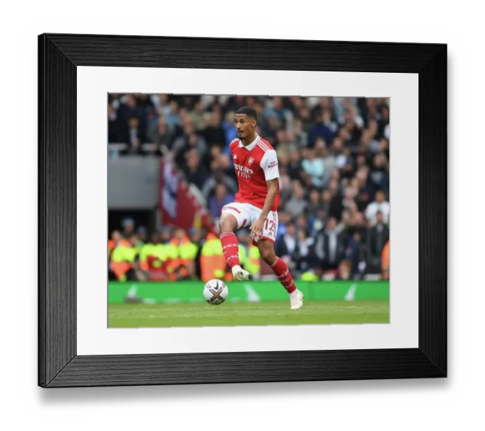 Framed Print : Arsenal's William Saliba Faces Off Against Tottenham in the 2022-23 Premier League Clash