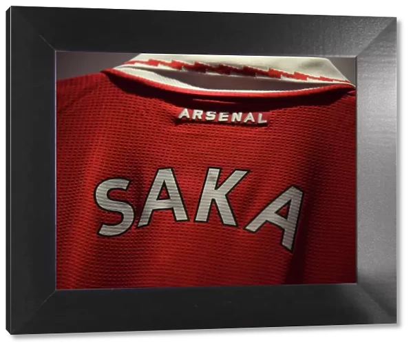 Bukayo Saka's Arsenal Jersey in the Emirates Changing Room: Preparing for Arsenal vs. Tottenham Hotspur (Premier League 2022-23)