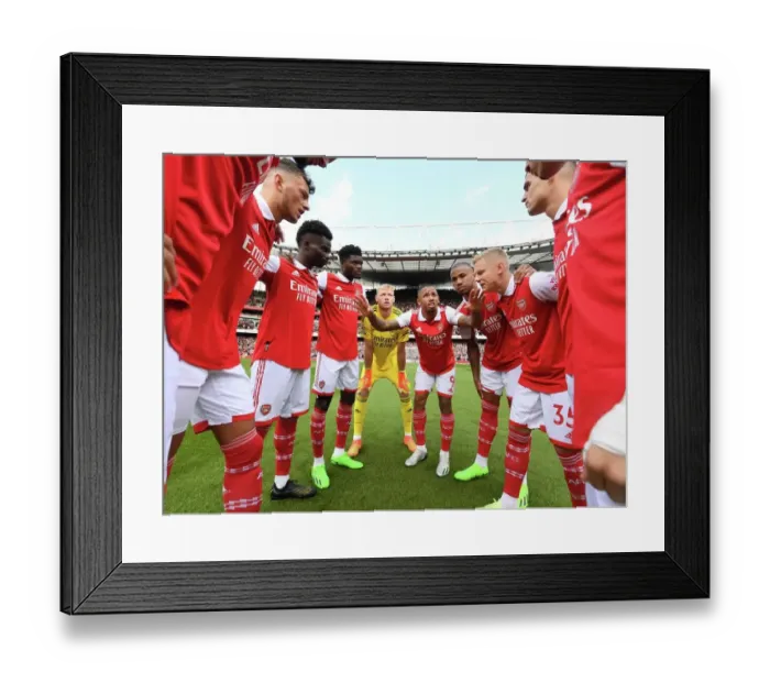 Framed Print : Arsenal Squad Unites: A Powerful Display of Team Spirit Against Tottenham in the Premier League 2022-23