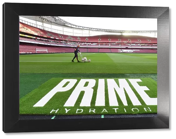 Arsenal vs. Tottenham: Preparing for Battle - Arsenal FC's Groundsman Marks the Emirates Stadium Pitch