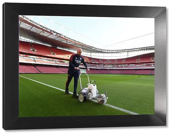 Battle Lines Drawn: Arsenal Groundsman Prepares Arsenal's Turf for the Big Match vs. Tottenham