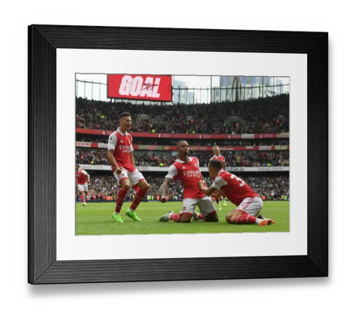 Framed Print : Arsenal's Unstoppable Trio: Jesus, Martinelli, and Xhaka Celebrate Double Strike Against Tottenham in the 2022-23 Premier League