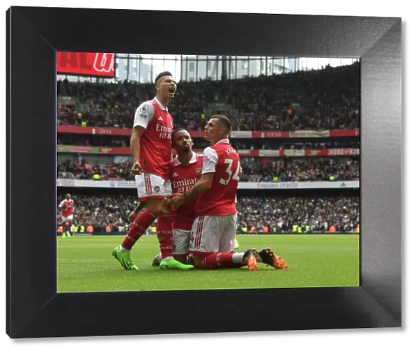 Arsenal's Gabriel Jesus and Martinelli Celebrate with Xhaka after Scoring against Tottenham in 2022-23 Premier League