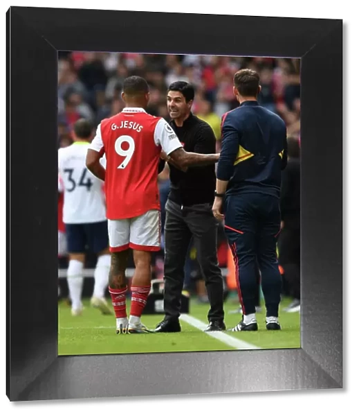 Arsenal Manager Mikel Arteta Strategizes with Gabriel Jesus: Arsenal vs. Tottenham (2022-23)