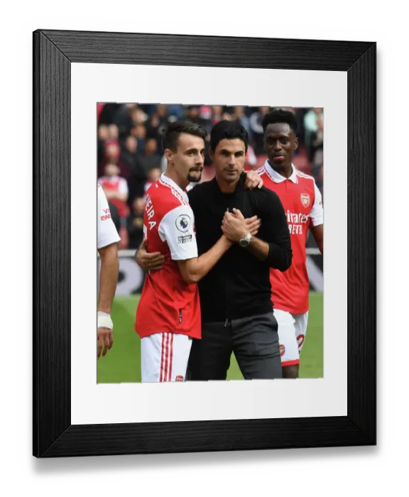 Framed Print : Arsenal Manager Mikel Arteta Celebrates with Fabio Vieira After Arsenal's Victory Against Tottenham Hotspur (2022-23)