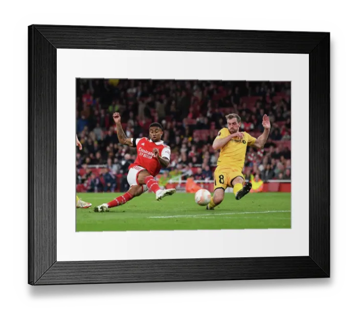 Framed Print : Arsenal vs. FK Bodo / Glimt: Tense Moment as Reiss Nelson Shoots in UEFA Europa League