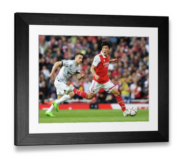 Framed Print : Arsenal vs Liverpool: Intense Battle - Tomiyasu vs Jota
