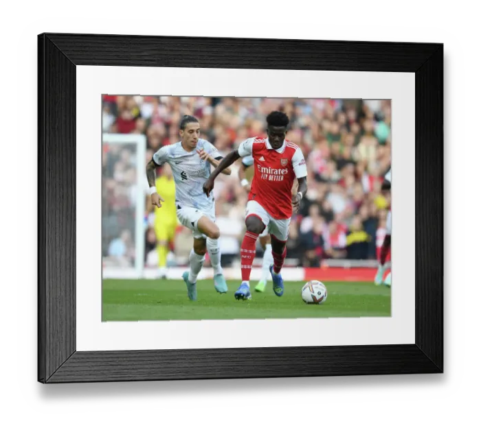 Framed Print : Arsenal's Ben White Outmaneuvers Liverpool's Tsimikas in Premier League Showdown (2022-23)