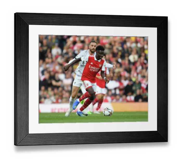 Framed Print : Saka's Skillful Dodge: Arsenal's Bukayo Saka Outmaneuvers Jordan Henderson in Premier League Clash Framed Print : Saka's Skillful Dodge: Arsenal's Bukayo Saka Outmaneuvers Jordan Henderson in Premier League Clash