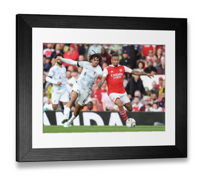 Framed Print : Arsenal vs. Liverpool: A Premier League Clash of Titans