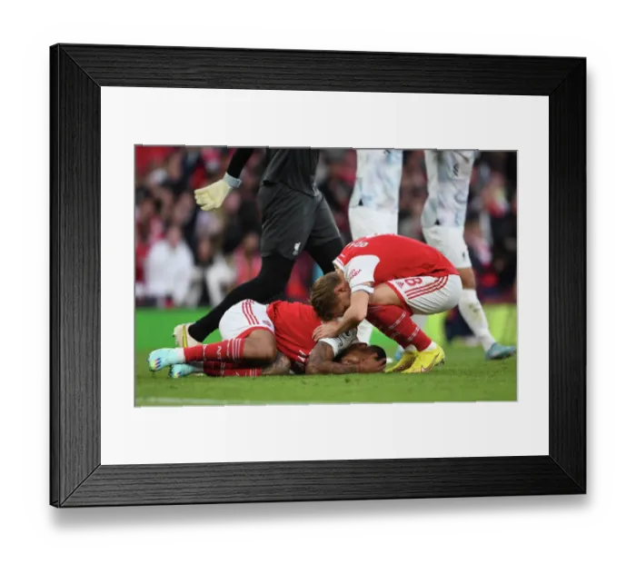 Framed Print : Arsenal's Martin Odegaard Comforts Injured Gabriel Jesus during Arsenal vs Liverpool (2022-23) Framed Print : Arsenal's Martin Odegaard Comforts Injured Gabriel Jesus during Arsenal vs Liverpool (2022-23)