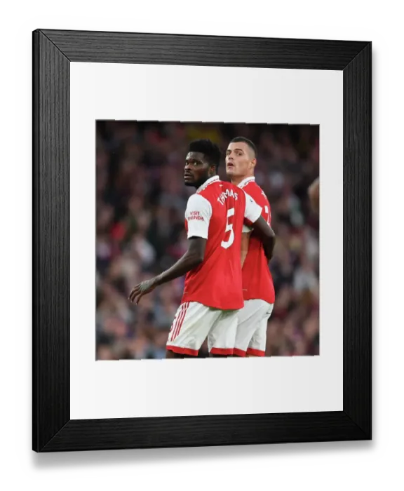 Framed Print : Arsenal's Midfield Battle: Partey vs. Xhaka - Arsenal v Liverpool (2022-23) Framed Print : Arsenal's Midfield Battle: Partey vs. Xhaka - Arsenal v Liverpool (2022-23)