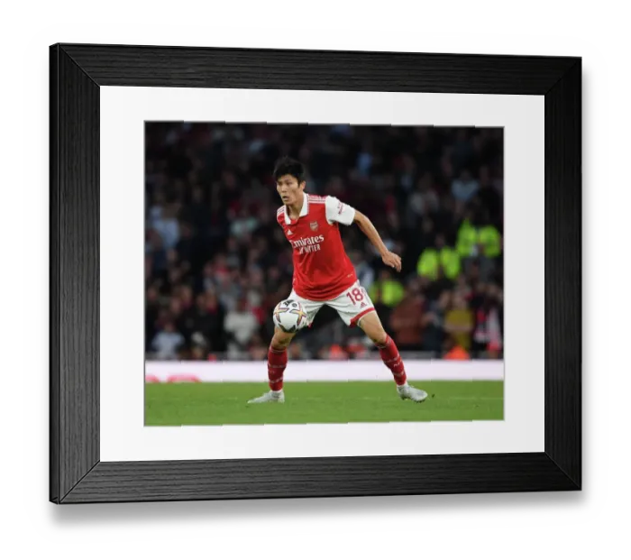 Framed Print : Tomiyasu vs. Liverpool: Arsenal's Defender in Premier League Showdown Framed Print : Tomiyasu vs. Liverpool: Arsenal's Defender in Premier League Showdown