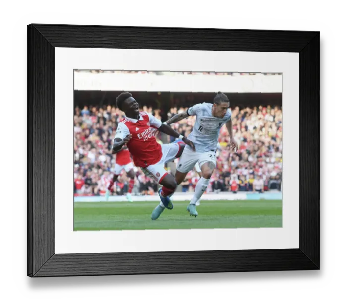 Framed Print : Arsenal vs. Liverpool: Bukayo Saka vs. Konstantinos Tsimikas Battle at Emirates Stadium (2022-23)