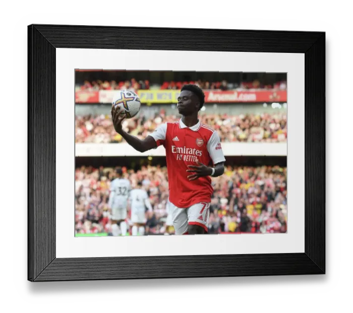 Framed Print : Bukayo Saka vs. Liverpool: Arsenal's Star Forward Battles in Premier League Showdown