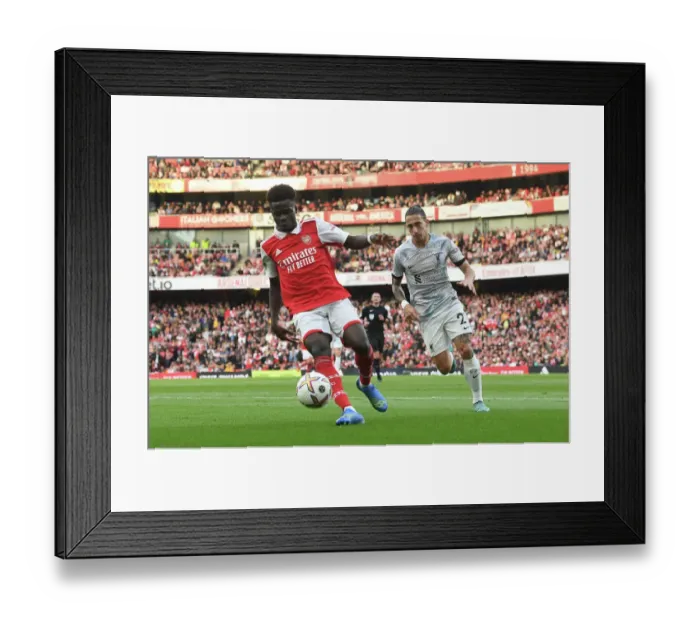Framed Print : Arsenal's Bukayo Saka Faces Off Against Liverpool in Thrilling 2022-23 Premier League Clash