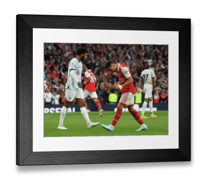 Framed Print : Arsenal's Triumph: Martinelli Celebrates Saka's Goal vs. Liverpool in the 2022-23 Premier League