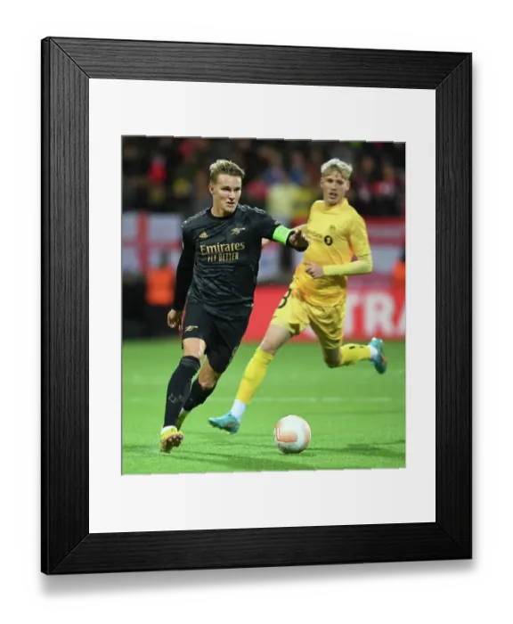Framed Print : Martin Odegaard in Action: Arsenal's Europa League Battle against Bodø / Glimt, Norway (2022-23) Framed Print : Martin Odegaard in Action: Arsenal's Europa League Battle against Bodø / Glimt, Norway (2022-23)