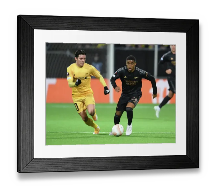 Framed Print : Reiss Nelson Breaks Past Bodø / Glimt's Defense in Arsenal's UEFA Europa League Clash