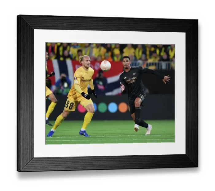 Framed Print : William Saliba Clashes with Lars Salvese: Arsenal vs. Bodø / Glimt, UEFA Europa League 2022-23 Framed Print : William Saliba Clashes with Lars Salvese: Arsenal vs. Bodø / Glimt, UEFA Europa League 2022-23
