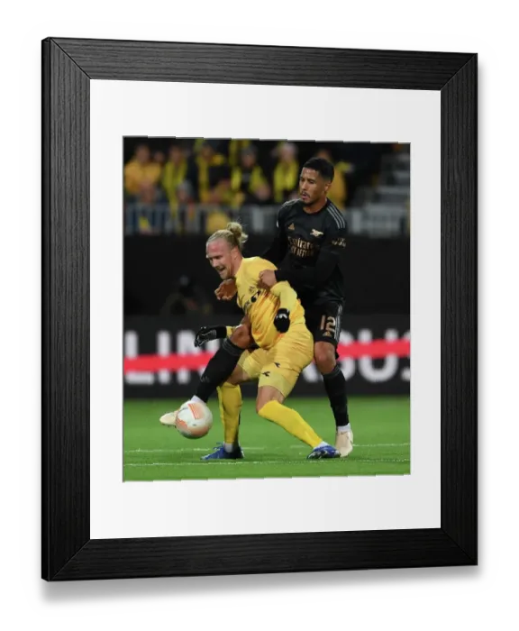 Framed Print : William Saliba vs. Lars Salvesen: Clash in UEFA Europa League Match between Bodø / Glimt and Arsenal FC