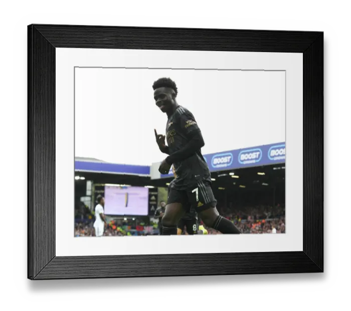 Framed Print : Saka Scores the Thriller: Arsenal Narrowly Wins Against Leeds United in Premier League