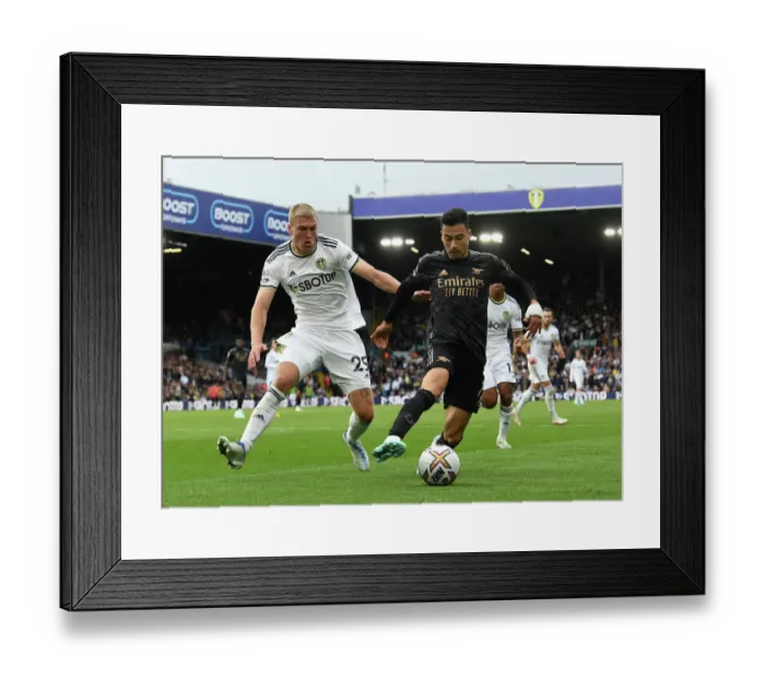 Framed Print : Martinelli Faces Off Against Kristensen: Leeds United vs. Arsenal FC, Premier League 2022-23